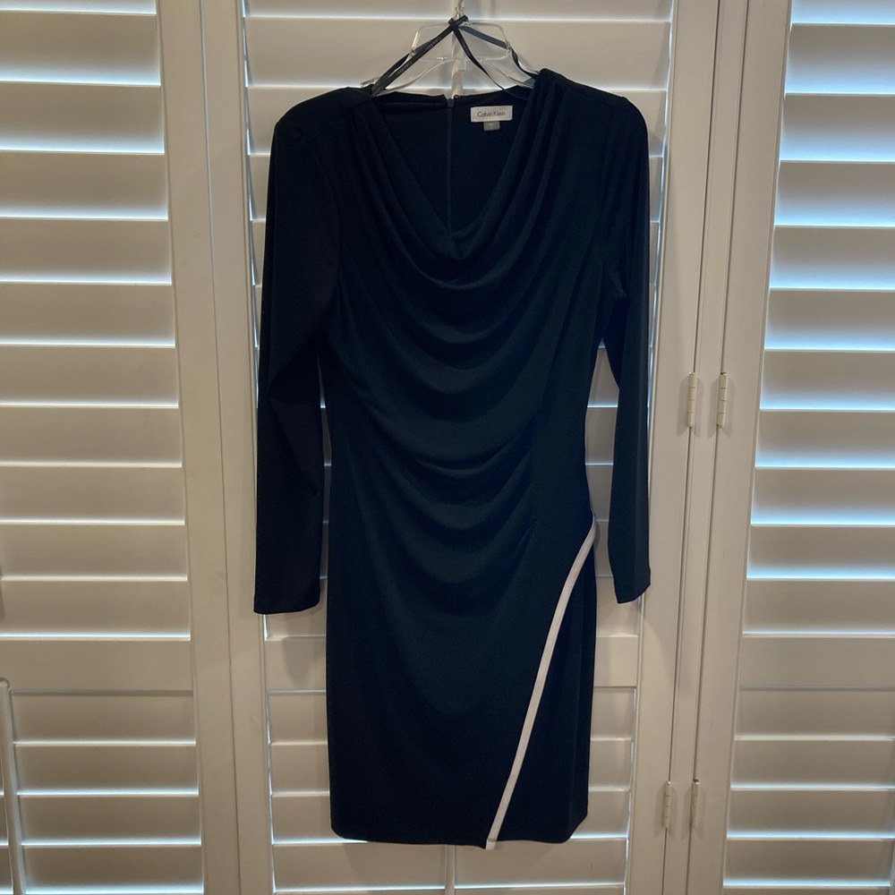 Black Calvin Klein dress like new.   Size 8.  Flattering fit w/accent trim.